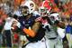 AUBURN, AL - NOVEMBER 16: Nick Marshall #14 of the Auburn Tigers is pursued by Ramik Wilson #51 of the Georgia Bulldogs at Jordan-Hare Stadium on November 16, 2013 in Auburn Alabama. (Photo by Scott Cunningham/Getty Images)