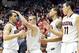 Dec 23, 2013; Tucson, AZ, USA; Arizona Wildcats guard Gabe York (1) is greeted by guard T.J. McConnell (4) forward Brandon Ashley (21) and forward Aaron Gordon (11) as he goes back to the bench during the second half against the Northern Arizona Lumberjac