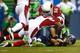 SEATTLE - DECEMBER 22: Russell Wilson #3 of the Seattle Seahawks is sacked by Javier Arenas #35 of the Arizona Cardinals on December 22, 2013 at CenturyLink Field in Seattle, Washington. (Photo by Jonathan Ferrey/Getty Images)