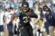 Dec 22, 2013; Jacksonville, FL, USA; Jacksonville Jaguars running back Maurice Jones-Drew (32) runs with the ball as Tennessee Titans defends during the second half at EverBank Field. Tennessee Titans defeated the Jacksonville Jaguars 20-16. Mandatory Cr