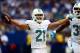 Sep 15, 2013; Indianapolis, IN, USA; Miami Dolphins cornerback Brent Grimes (21) celebrates with teammate after intercepting a pass during the third quarter against the Indianapolis Colts at Lucas Oil Stadium. Mandatory Credit: Andrew Weber-USA TODAY Spor