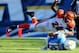 SAN DIEGO, CA - DECEMBER 01: Cornerback Adam Jones #24 of the Cincinnati Bengals makes a tackle against Keenan Allen #13 of the San Diego Chargers at Qualcomm Stadium on December 1, 2013 in San Diego, California. The Bengals won 17-10. (Photo by Stephen