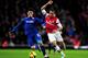 LONDON, ENGLAND - JANUARY 01: Theo Walcott of Arsenal takes on Kim Bo-Kyung of Cardiff City during the Barclays Premier League match between Arsenal and Cardiff City at Emirates Stadium on January 1, 2014 in London, England. (Photo by Shaun Botterill/Ge