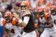 CLEVELAND, OH - SEPTEMBER 29: Quarterback Brian Hoyer #6 of the Cleveland Browns looks for a pass under pressure from the Cincinnati Bengals defense during the second half at FirstEnergy Stadium on September 29, 2013 in Cleveland, Ohio. The Browns defeate