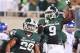 August 31, 2012; East Lansing, MI, USA; Michigan State Spartans safety Isaiah Lewis (9) and linebacker Denicos Allen (28) celebrate after interception during the first half against the Boise State Broncos at Spartan Stadium. Mandatory Credit: Mike Cart
