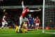 LONDON, ENGLAND - JANUARY 01: Nicklas Bendtner of Arsenal turns away in celebration as he scores their first goal past goalkeeper David Marshall of Cardiff City (grounded) during the Barclays Premier League match between Arsenal and Cardiff City at Emira