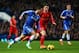 LONDON, ENGLAND - DECEMBER 29: Eden Hazard of Chelsea is pursued by Joe Allen of Liverpool during the Barclays Premier League match between Chelsea and Liverpool at Stamford Bridge on December 29, 2013 in London, England. (Photo by Julian Finney/Getty I