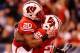 INDIANAPOLIS, IN - DECEMBER 01: Melvin Gordon #25 of the Wisconsin Badgers celebrates a first quarter touchdown with James White #20 while playing the Nebraska Cornhuskers during the Big 10 Conference Championship Game at Lucas Oil Stadium on December 1,