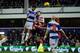 LONDON, ENGLAND - JANUARY 1: Charlie Austin of Queens Park Rangers scores his team's 2nd goal as he's challenged by Liam Wakefield Doncaster Rovers during the Sky Bet Championship match between Queens Park Rangers and Doncaster Rovers at Loftus Road on Ja