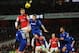 LONDON, ENGLAND - JANUARY 01: Per Mertesacker of Arsenal jumps with Kevin McNaughton of Cardiff City during the Barclays Premier League match between Arsenal and Cardiff City at Emirates Stadium on January 1, 2014 in London, England. (Photo by Shaun Bot