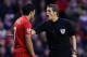 LIVERPOOL, ENGLAND - JANUARY 01: Luis Suarez of Liverpool argues with referee Mr C Pawson during the Barclays Premier League match between Liverpool and Hull City at Anfield on January 1, 2014 in Liverpool, England. (Photo by Clive Brunskill/Getty Image