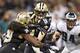 NEW ORLEANS, LA - NOVEMBER 5: Drew Brees #9 makes a hand off to Travaris Cadet #29 of the New Orleans Saints during a game against the Philadelphia Eagles at Mercedes-Benz Superdome on November 5, 2012 in New Orleans, Louisiana. The Saints defeated the