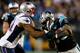 CHARLOTTE, NC - NOVEMBER 18: Aqib Talib #31 of the New England Patriots tackles Steve Smith #89 of the Carolina Panthers during their game at Bank of America Stadium on November 18, 2013 in Charlotte, North Carolina. (Photo by Streeter Lecka/Getty Imag
