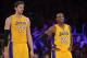 Dec 10, 2013; Los Angeles, CA, USA; Los Angeles Lakers forward Pau Gasol (16) and guard Kobe Bryant (24) react during the game against the Phoenix Suns at Staples Center. The Suns defeated the Lakers 114-108. Mandatory Credit: Kirby Lee-USA TODAY Sports