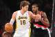 December 1, 2013; Los Angeles, CA, USA; Los Angeles Lakers center Pau Gasol (16) moves the ball against the defense of Portland Trail Blazers power forward LaMarcus Aldridge (12) during the first half at Staples Center. Mandatory Credit: Gary A. Vasquez-U