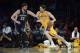 Nov 15, 2013; Los Angeles, CA, USA; Los Angeles Lakers center Pau Gasol (16) handles the ball defended by Memphis Grizzlies center Marc Gasol (33) during the first quarter at Staples Center. Mandatory Credit: Kelvin Kuo-USA TODAY Sports