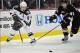 December 11, 2013; Anaheim, CA, USA; Minnesota Wild left wing Zach Parise (11) moves the puck against the defense of Anaheim Ducks defenseman Sami Vatanen (45) during the first period at Honda Center. Mandatory Credit: Gary A. Vasquez-USA TODAY Sports