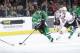 DALLAS, TX - DECEMBER 10: Tyler Seguin #91 of the Dallas Stars tries to keep the puck away from Jonathan Toews #19 of the Chicago Blackhawks at the American Airlines Center on December 10, 2013 in Dallas, Texas. (Photo by Glenn James/NHLI via Getty Images