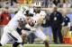 Jan 1, 2014; Glendale, AZ, USA; UCF Knights quarterback Blake Bortles (5) hands the ball off to running back Storm Johnson (8) during the first quarter against the Baylor Bears at University of Phoenix Stadium during the Fiesta Bowl. Mandatory Credit: Cas