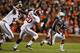 AUBURN, AL - NOVEMBER 30: Tre Mason #21 of the Auburn Tigers runs the ball in the second quarter against Jarrick Williams #20 of the Alabama Crimson Tide at Jordan-Hare Stadium on November 30, 2013 in Auburn, Alabama. (Photo by Kevin C. Cox/Getty Images