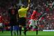 MANCHESTER, ENGLAND - SEPTEMBER 14: Ashley Young of Manchester United is booked by referee Jonathan Moss for diving during the Barclays Premier League match between Manchester United and Crystal Palace at Old Trafford on September 14, 2013 in Manchester,