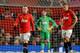 Wayne Rooney and captain Nemanja Vidic after United concede the second goal against Tottenham.