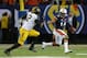ATLANTA, GA - DECEMBER 07: Nick Marshall #14 of the Auburn Tigers runs the ball against Darvin Ruise #12 of the Missouri Tigers during the SEC Championship Game at Georgia Dome on December 7, 2013 in Atlanta, Georgia. (Photo by Mike Ehrmann/Getty Images
