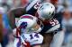 FOXBORO, MA - NOVEMBER 11: Brandon Spikes #55 of the New England Patriots hits Ryan Fitzpatrick #14 of the Buffalo Bills before being flagged for a personal foul in the second half during the game on November 11, 2012 at Gillette Stadium in Foxboro, Mass