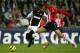 EINDHOVEN, HOLLAND - FEBRUARY 22: Emmanuel Adebayor of Monaco battles with Alex of PSV during the UEFA Champions League first knock-out round, first leg match between PSV Eindhoven and AS Monaco at the Phillips Stadium on February 22, 2005 in Eindhoven,