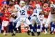 KANSAS CITY, MO - DECEMBER 22: Quarterback Andrew Luck #12 of the Indianapolis Colts passes during the game against the Kansas City Chiefs at Arrowhead Stadium on December 22, 2013 in Kansas City, Missouri. (Photo by Jamie Squire/Getty Images)
