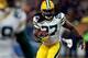 CHICAGO, IL - DECEMBER 29: Running back Eddie Lacy #27 of the Green Bay Packers carries the ball against the Chicago Bears during a game at Soldier Field on December 29, 2013 in Chicago, Illinois. (Photo by Jonathan Daniel/Getty Images)