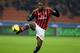 MILAN, ITALY - NOVEMBER 23: Mario Balotelli of AC Milan in action during the Serie A match between AC Milan and Genoa CFC at Stadio Giuseppe Meazza on November 23, 2013 in Milan, Italy. (Photo by Claudio Villa/Getty Images)