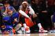 NEW YORK, NY - NOVEMBER 16: Carmelo Anthony #7 of the New York Knicks sits on the baseline during the final minutes of the game against the Atlanta Hawks at Madison Square Garden on November 16, 2013 in New York City. The Hawks defeat the Knicks 110-90.