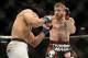 Dec 28, 2013; Las Vegas, NV, USA; Jim Miller (red gloves) and Fabricio Camoes (blue gloves) fight during their UFC lightweight bout at the MGM Grand Garden Arena. Mandatory Credit: Jayne Kamin-Oncea-USA TODAY Sports