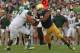 SOUTH BEND, IN - SEPTEMBER 21: Stephon Tuitt #7 of the Notre Dame Fighting Irish rushes against Jack Conklin #74 of the Michigan State Spartans at Notre Dame Stadium on September 21, 2013 in South Bend, Indiana. Notre Dame defeated Michigan State 17-13.