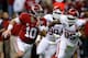 NEW ORLEANS, LA - JANUARY 02: AJ McCarron #10 of the Alabama Crimson Tide runs with the ball past Geneo Grissom #85 of the Oklahoma Sooners during the Allstate Sugar Bowl at the Mercedes-Benz Superdome on January 2, 2014 in New Orleans, Louisiana. (Phot