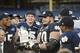 Dec 28, 2013; Bronx, NY, USA; Notre Dame Fighting Irish offensive tackle Zack Martin (70) is awarded the game's MVP trophy against the Rutgers Scarlet Knights in the Pinstripe Bowl at Yankees Stadium. Notre Dame Fighting Irish won the game 29-16. Mandator