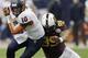 HOUSTON, TX - DECEMBER 27: Terrel Hunt #10 of the Syracuse Orange shakes off a tackle attempt by Ra'Shede Hageman #99 of the Minnesota Golden Gophers in the fourth quarter at Reliant Stadium on December 27, 2013 in Houston, Texas. (Photo by Bob Levey/Ge