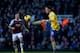 LONDON, ENGLAND - DECEMBER 26: Mesut Oezil of Arsenal is watched by Mark Noble of West Ham United during the Barclays Premier League match between West Ham United and Arsenal at Boleyn Ground on December 26, 2013 in London, England. (Photo by Ian Walton