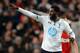 MANCHESTER, ENGLAND - JANUARY 01: Emmanuel Adebayor of Tottenham Hotspur celebrates scoring the opening goal during the Barclays Premier League match between Manchester United and Tottenham Hotspur at Old Trafford on January 1, 2014 in Manchester, Englan