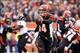 Dec 29, 2013; Cincinnati, OH, USA; Cincinnati Bengals quarterback Andy Dalton (14) runs the ball for a touchdown against the Baltimore Ravens in the fourth quarter at Paul Brown Stadium. Cincinnati defeated Baltimore 34-17. Mandatory Credit: Mark Zerof-US