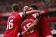 LONDON, ENGLAND - AUGUST 17: Olivier Giroud of Arsenal (R) celebrates after scoring the opening goal with team mates Aaron Ramsey, Tomas Rosicky and Alex Oxlade-Chamberlain during the Barclays Premier League match between Arsenal and Aston Villa at Emira