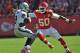 KANSAS CITY, MO - OCTOBER 13: Linebacker Justin Houston #50 of the Kansas City Chiefs closes in on quarterback Terrelle Pryor #2 of the Oakland Raiders during the first half on October 13, 2013 at Arrowhead Stadium in Kansas City, Missouri. (Photo by Pete