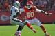KANSAS CITY, MO - OCTOBER 13: Linebacker Justin Houston #50 of the Kansas City Chiefs closes in on quarterback Terrelle Pryor #2 of the Oakland Raiders during the first half on October 13, 2013 at Arrowhead Stadium in Kansas City, Missouri. (Photo by Pete