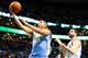 BOSTON, MA - DECEMBER 06: Andre Miller #24 of the Denver Nuggets drives to the basket for a layup in front of Vitor Faverani #38 of the Boston Celtics in the second half during the game at TD Garden on December 6, 2013 in Boston, Massachusetts. NOTE TO US