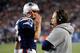 FOXBORO, MA - JANUARY 13: Tom Brady #12 of the New England Patriots wlaks past head coach Bill Belichick of the New England Patriots against the Houston Texans during the 2013 AFC Divisional Playoffs game at Gillette Stadium on January 13, 2013 in Foxbor