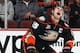 ANAHEIM, CA - DECEMBER 31: Ryan Getzlaf #15 of the Anaheim Ducks reacts after being hit in the face by the puck during the game against the San Jose Sharks on December 31, 2013 at Honda Center in Anaheim, California. (Photo by Debora Robinson/NHLI via Ge