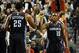 Jan. 02, 2014; Portland, OR, USA; Charlotte Bobcats point guard Kemba Walker (15) celebrates with center Al Jefferson (25) after scoring a basket during the third quarter of the game against the Portland Trail Blazers at the Moda Center. Mandatory Credit: