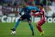 MADRID, SPAIN - DECEMBER 11: Fernando Reges (L) of FC Porto competes for the ball with Oliver Torres (R) of Atletico de Madrid during the UEFA Champions League Group G match at Vicente Calderon Stadium on December 11, 2013 in Madrid, Spain. (Photo by Go