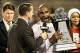 Dec 28, 2013; Orlando, FL, USA; Louisville Cardinals head coach Charlie Strong is presented with the Russell Athletic Bowl trophy after defeating the Miami Hurricanes at Florida Citrus Bowl Stadium. Mandatory Credit: Rob Foldy-USA TODAY Sports